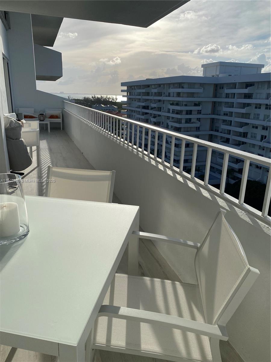 199 Ocean Ln Drive, Unit 1112 Key Biscayne, FL 33149 - Photo 14 of 36 a view of a balcony with an outdoor space