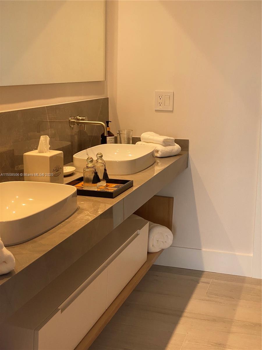 199 Ocean Ln Drive, Unit 1112 Key Biscayne, FL 33149 - Photo 16 of 36 a bathroom with a sink and a mirror