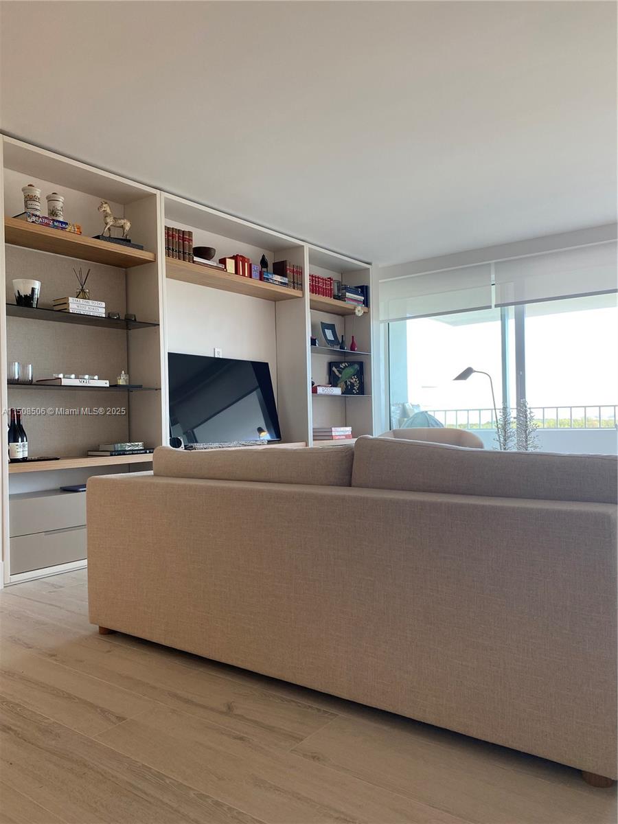 199 Ocean Ln Drive, Unit 1112 Key Biscayne, FL 33149 - Photo 19 of 36 a living room with furniture and a window