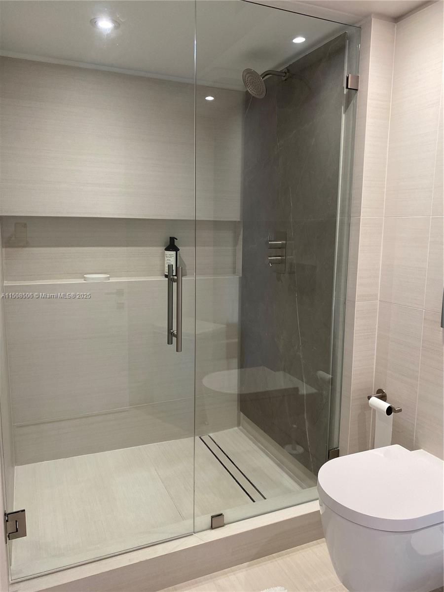 199 Ocean Ln Drive, Unit 1112 Key Biscayne, FL 33149 - Photo 22 of 36 a bathroom with a shower and a toilet