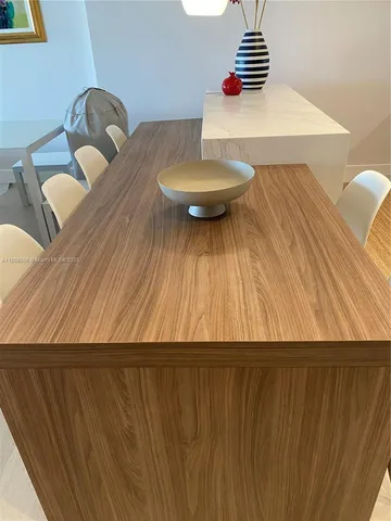 a view of a dining room with furniture and window