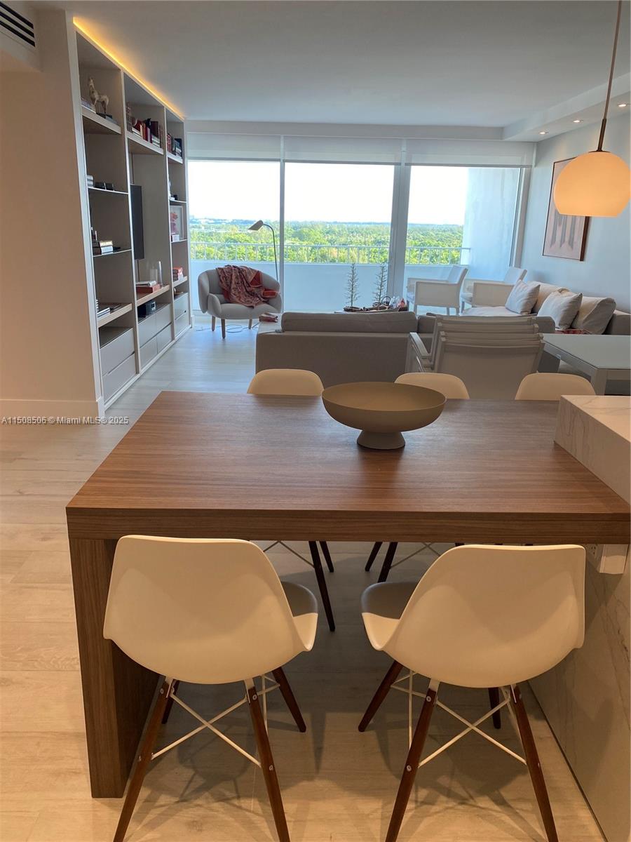 199 Ocean Ln Drive, Unit 1112 Key Biscayne, FL 33149 - Photo 25 of 36 a view of a dining room with furniture and window