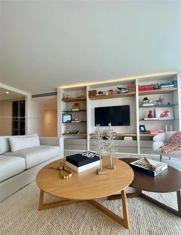 a kitchen with a table chairs stove and kitchen island