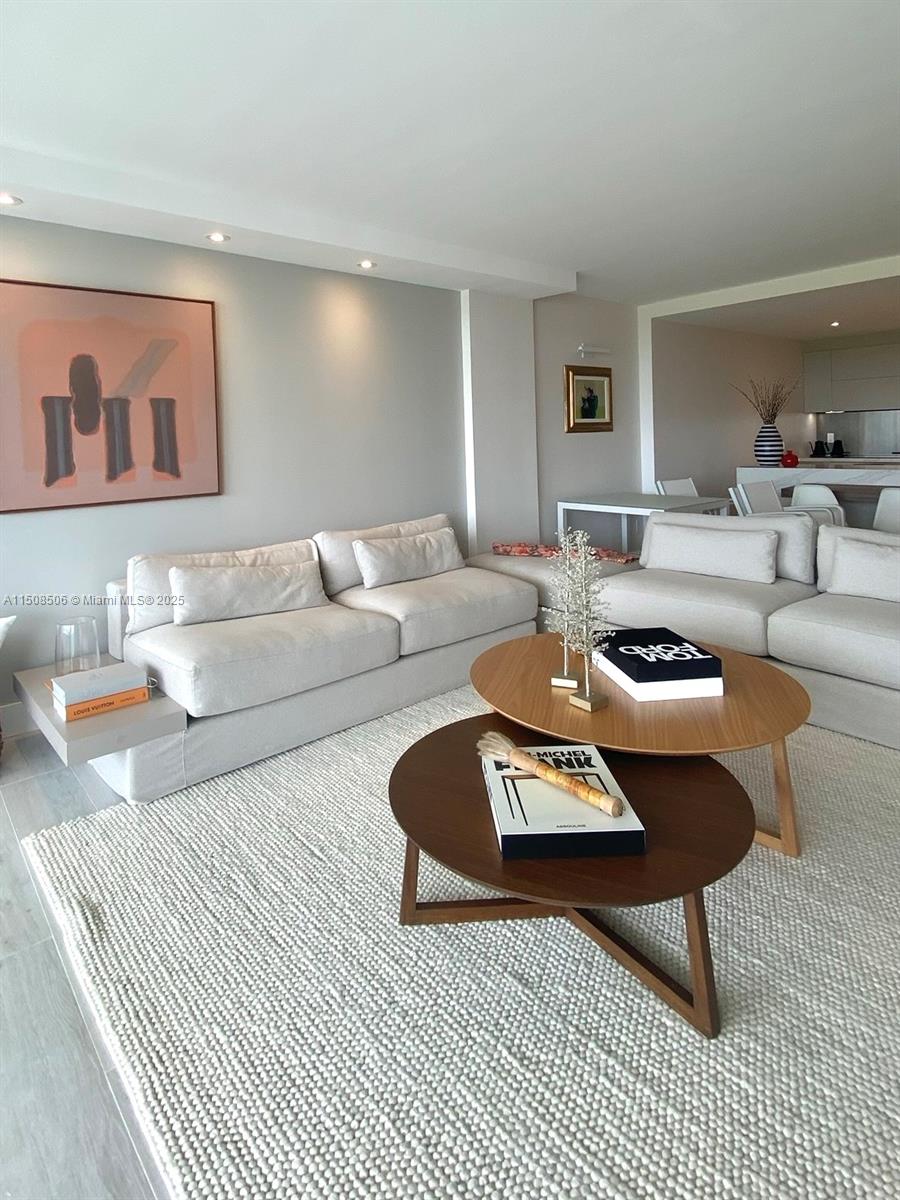 199 Ocean Ln Drive, Unit 1112 Key Biscayne, FL 33149 - Photo 30 of 36 a living room with furniture and a table
