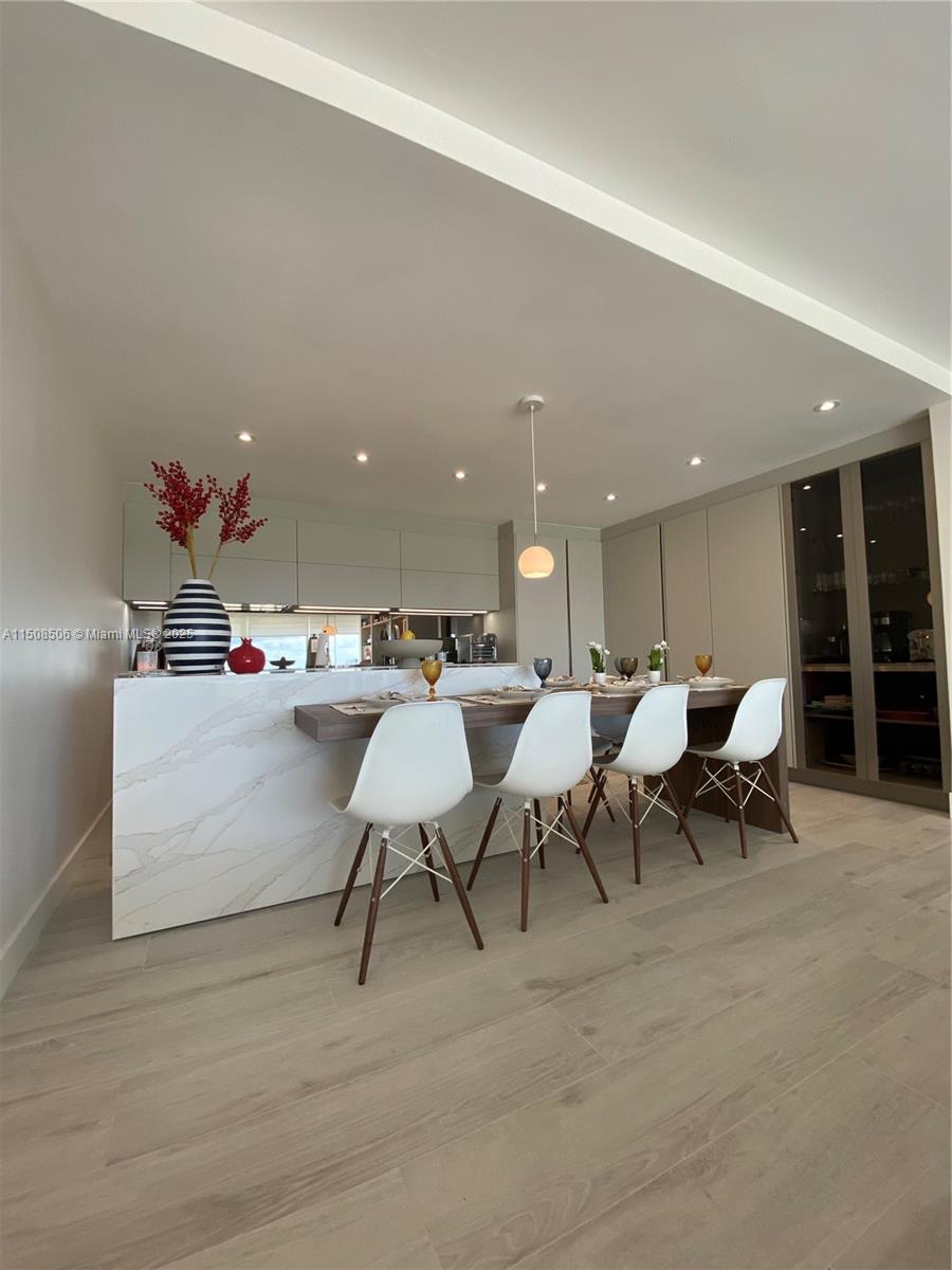 199 Ocean Ln Drive, Unit 1112 Key Biscayne, FL 33149 - Photo 3 of 36 a group of people sitting at living room