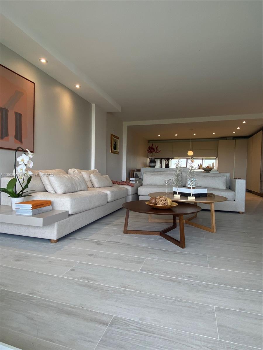 199 Ocean Ln Drive, Unit 1112 Key Biscayne, FL 33149 - Photo 4 of 36 a living room with furniture and a table