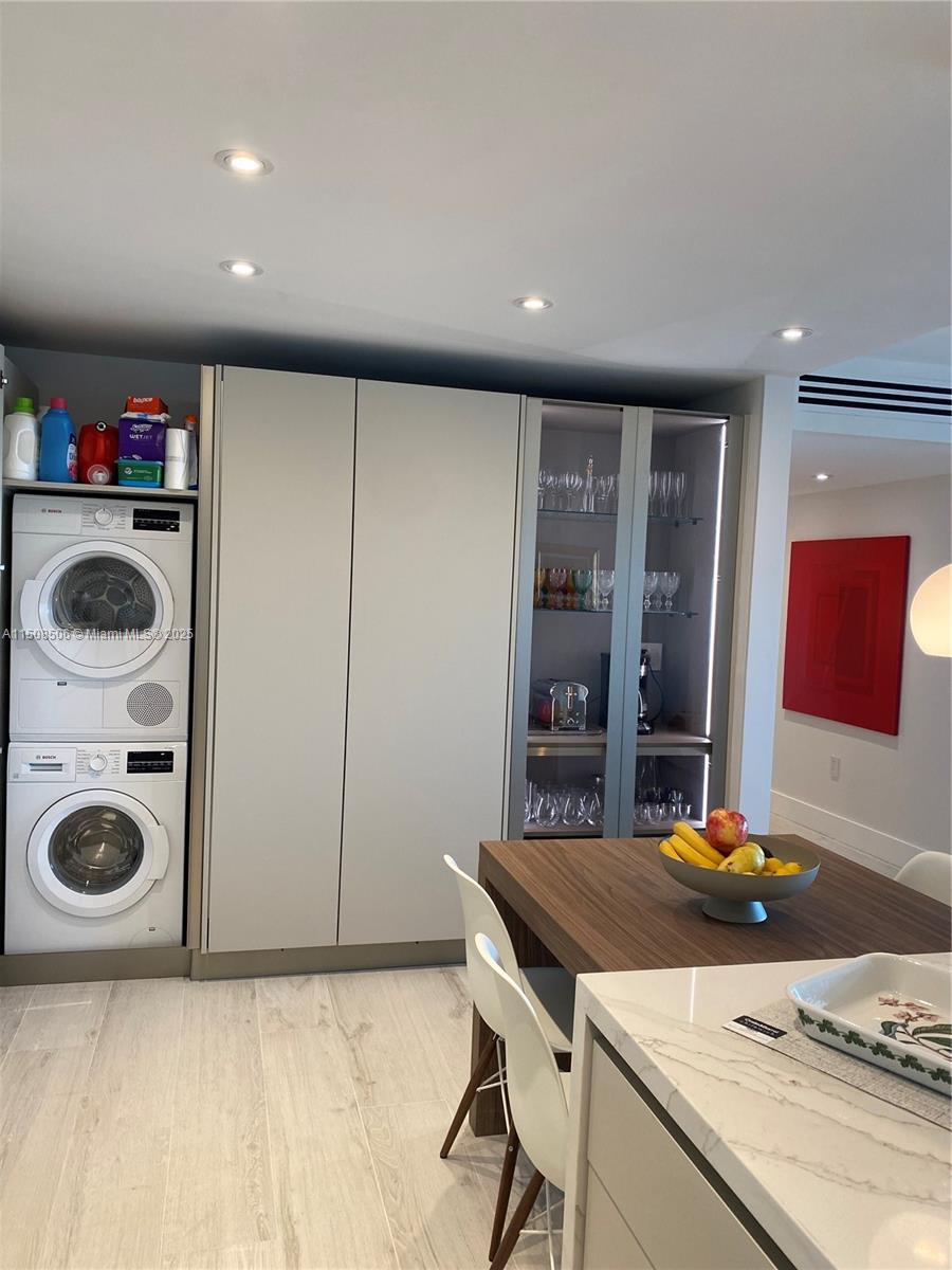 199 Ocean Ln Drive, Unit 1112 Key Biscayne, FL 33149 - Photo 9 of 36 a kitchen with a table and chairs in it