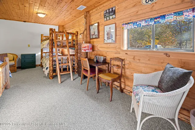 a spacious bathroom with a granite countertop sink and a large mirror