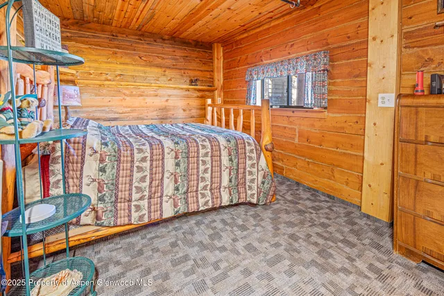 a view of a big yard with an ocean view