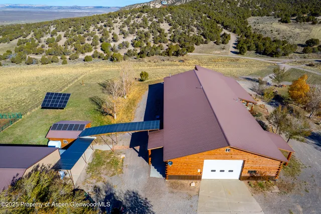 a view of a lake in front of residential houses with outdoor space