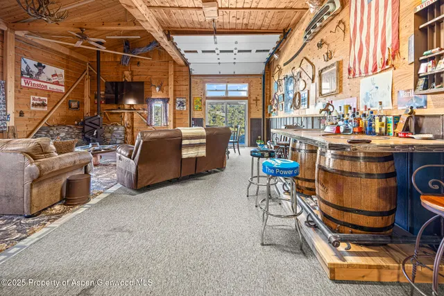 a bedroom with a bed a table and chair