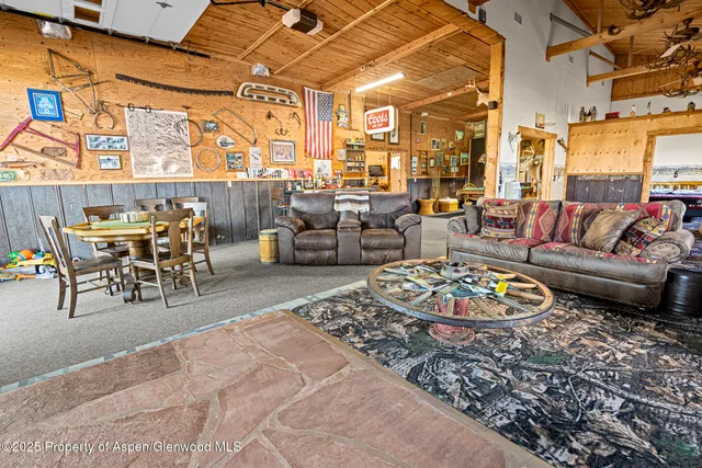 a living room with furniture rug and wooden floor