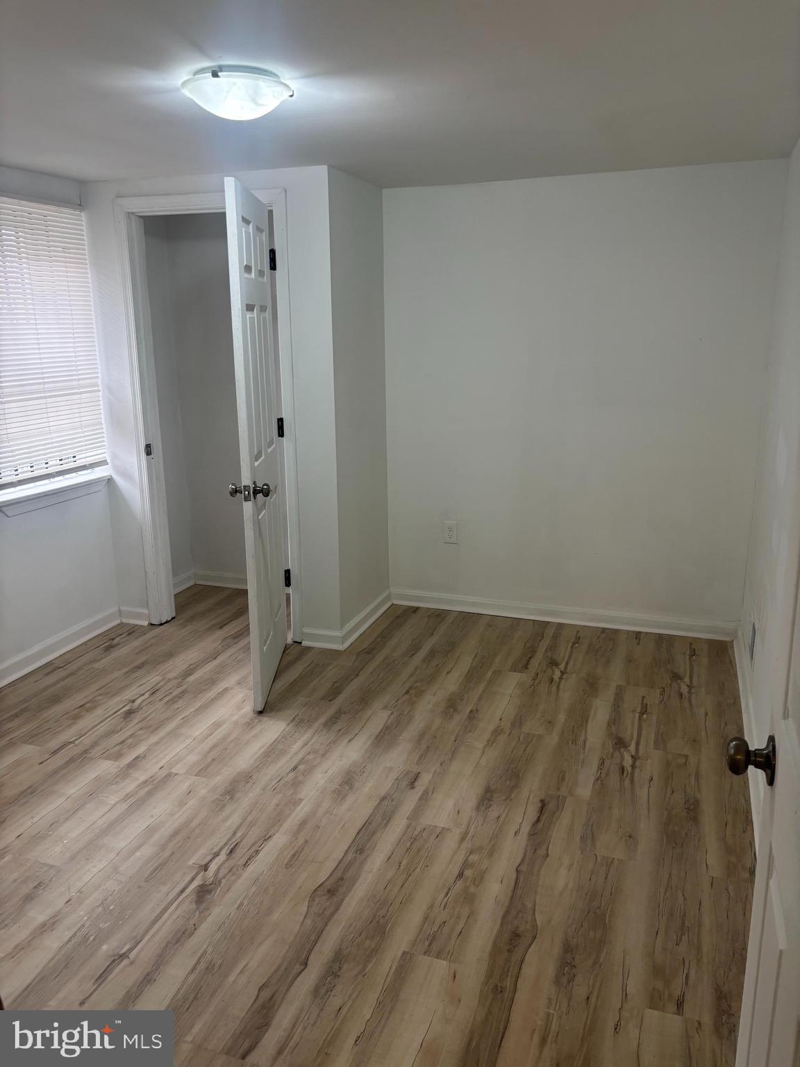 1623 West Lexington Street Baltimore, MD 21223 - Photo 12 of 26 wooden floor in an empty room