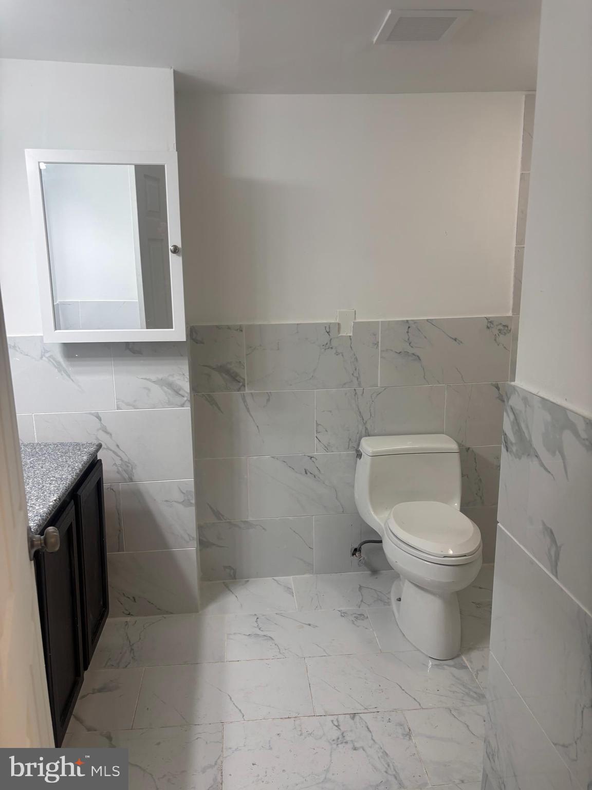 1623 West Lexington Street Baltimore, MD 21223 - Photo 16 of 26 a bathroom with a toilet and a sink