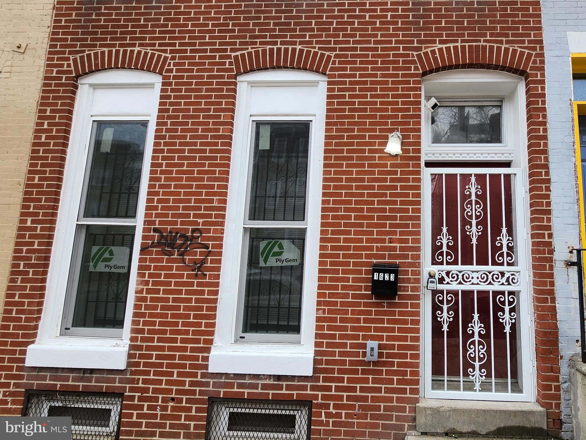 1623 West Lexington Street Baltimore, MD 21223 - Photo 4 of 26 a front view of a house with a door
