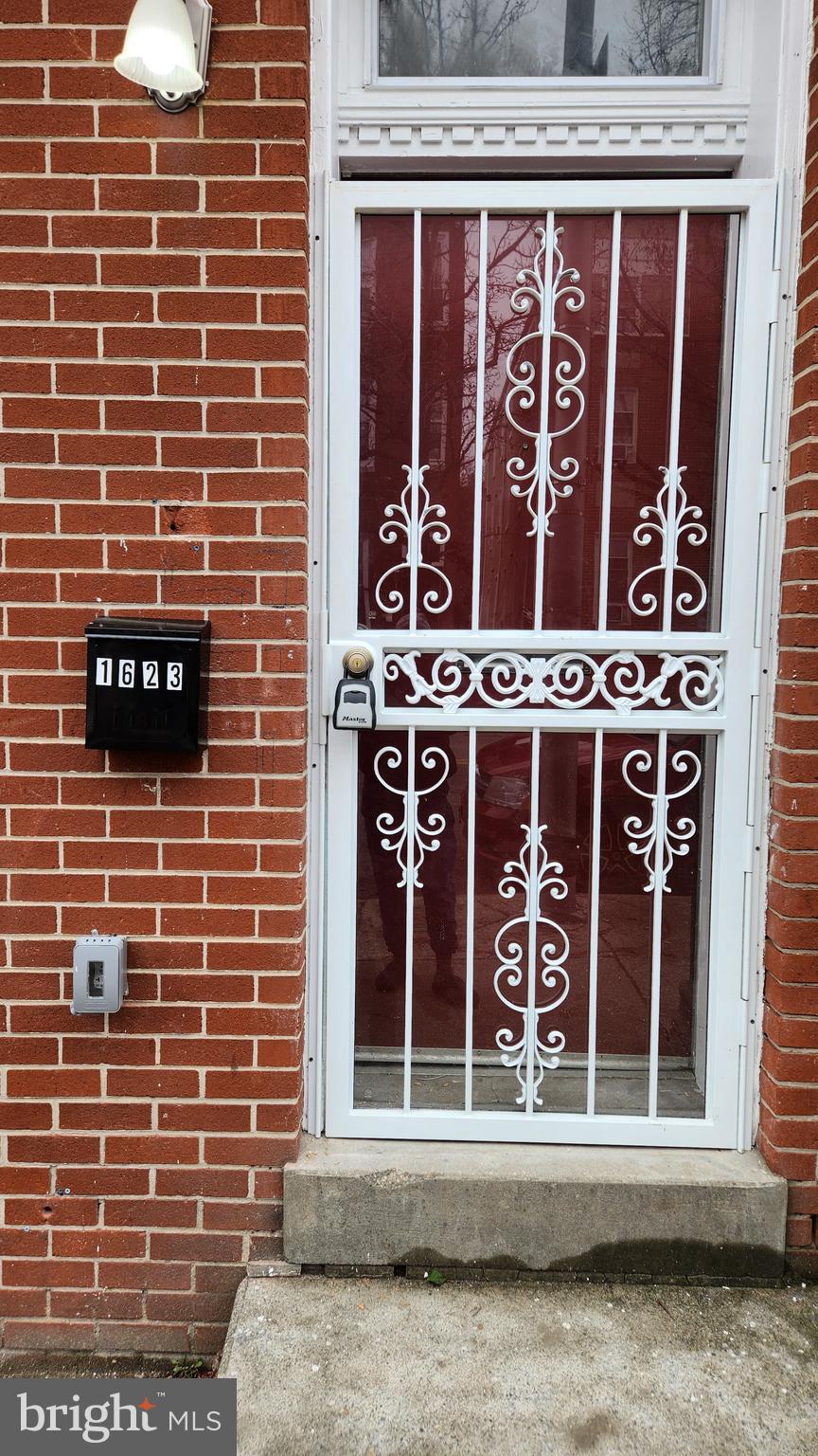 1623 West Lexington Street Baltimore, MD 21223 - Photo 5 of 26 a view of a door with a window