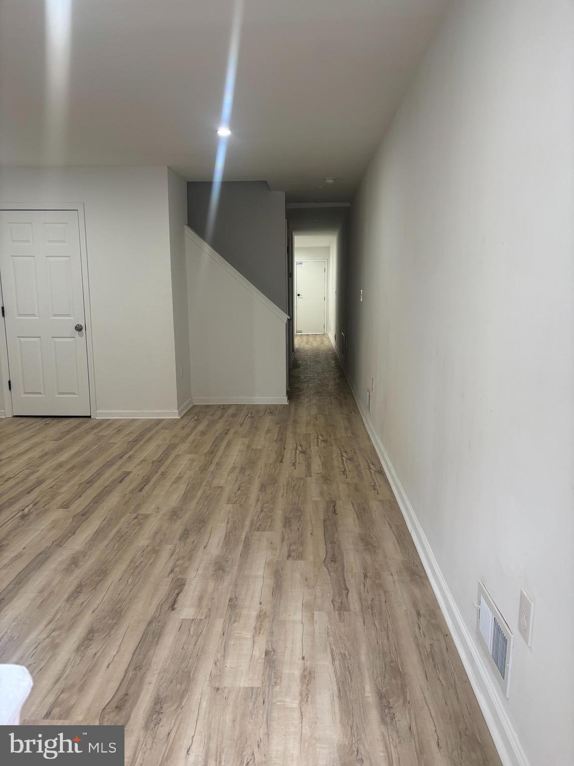 1623 West Lexington Street Baltimore, MD 21223 - Photo 10 of 26 a view of hallway with wooden floor