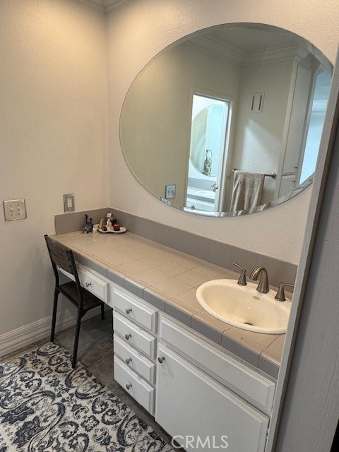 71942 Eleanora Lane Rancho Mirage, CA 92270 - Photo 17 of 31 a bathroom with a sink and a mirror