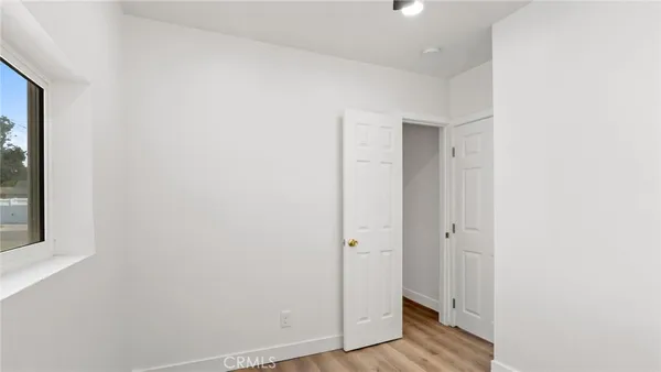 a view of a bathroom with wooden floor