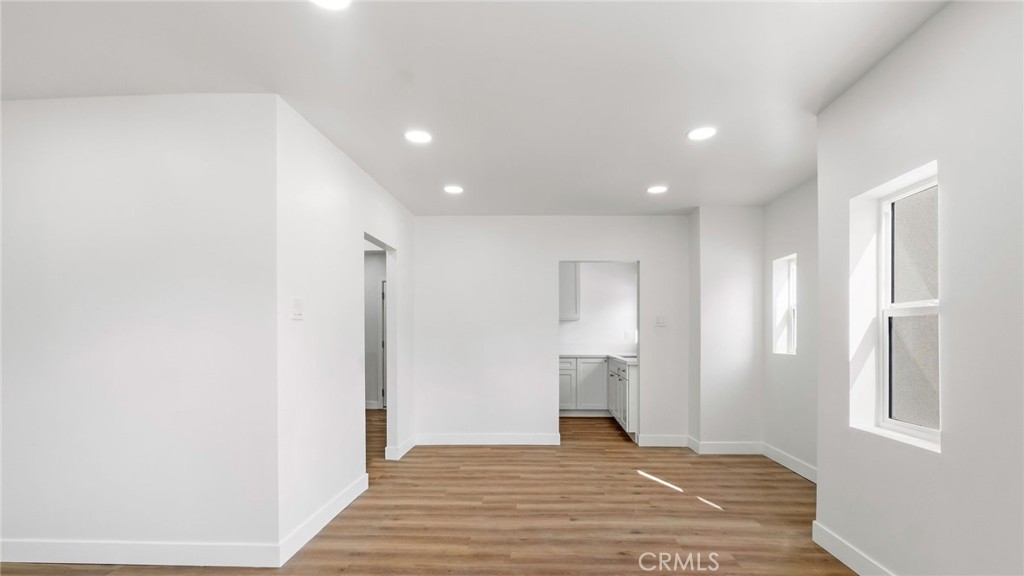3309 Locust Street Riverside, CA 92501 - Photo 10 of 10 a view of a livingroom with wooden floor and staircase