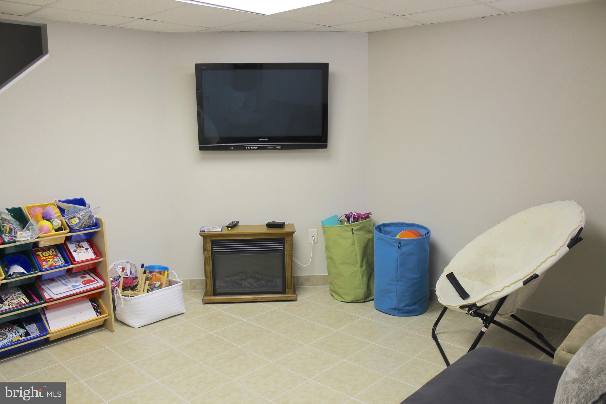 313 Madison Road Springfield, PA 19064 - Photo 25 of 32 Finished basement with ceramic tile floor