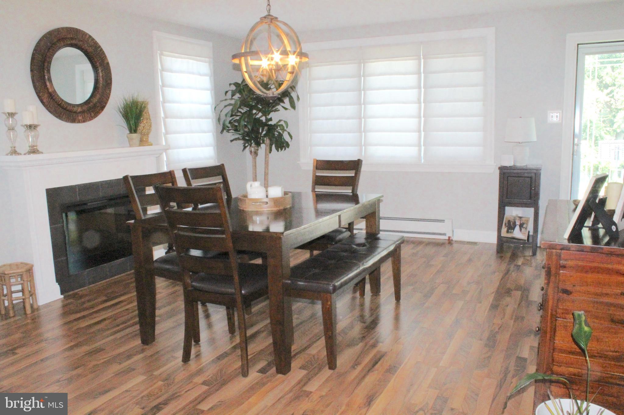 313 Madison Road Springfield, PA 19064 - Photo 10 of 32 Dining room with fireplace