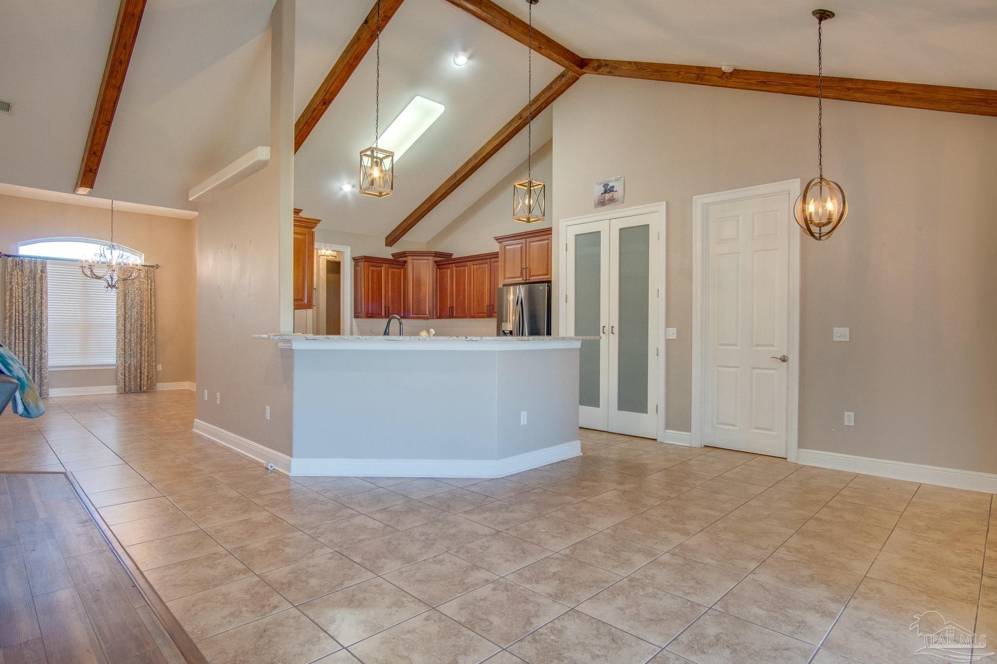 2655 Masters Boulevard Navarre, FL 32566 - Photo 11 of 43 a view of a big room with closet and windows