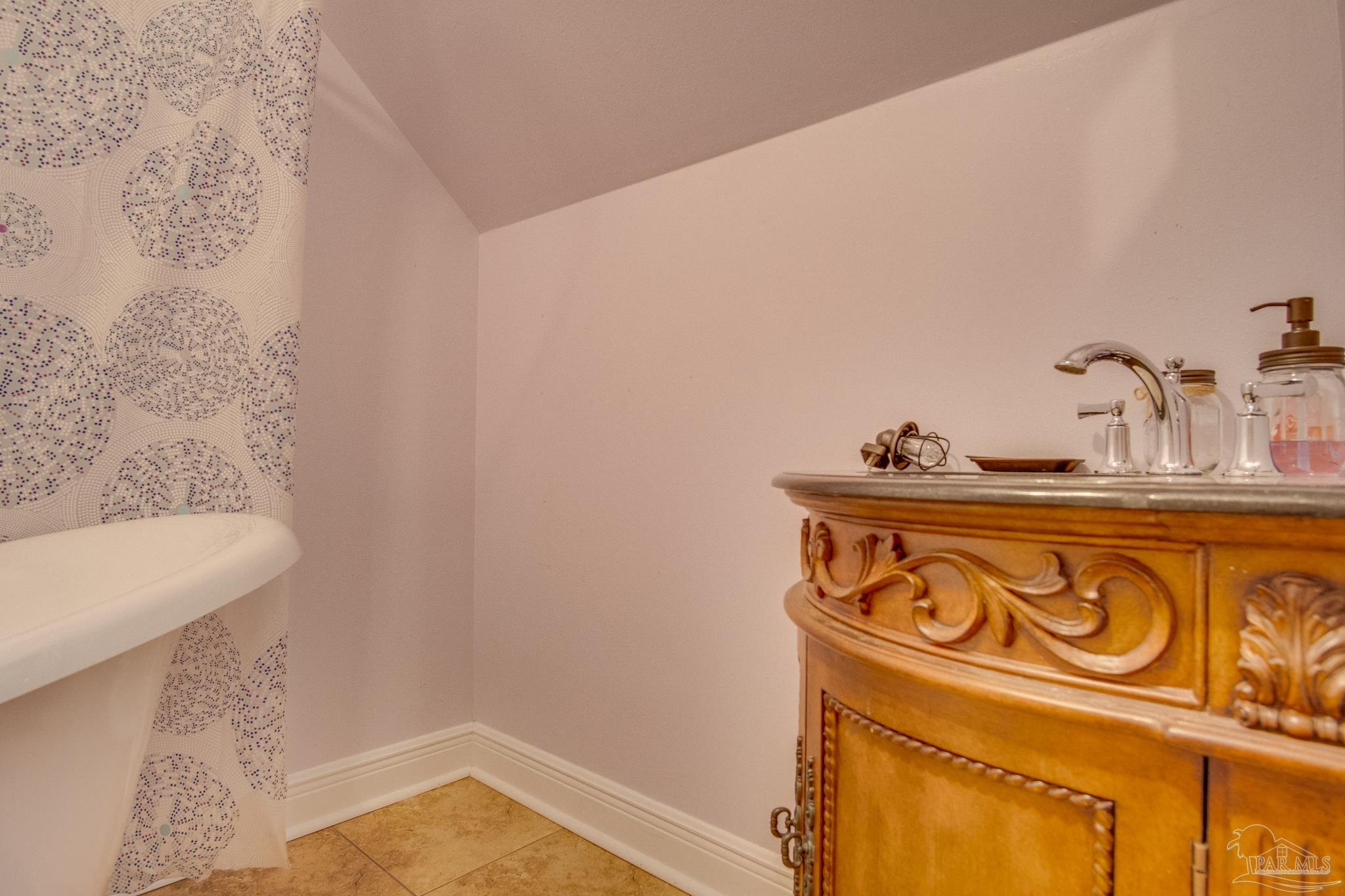 2655 Masters Boulevard Navarre, FL 32566 - Photo 35 of 43 a bathroom with a bathtub and shower