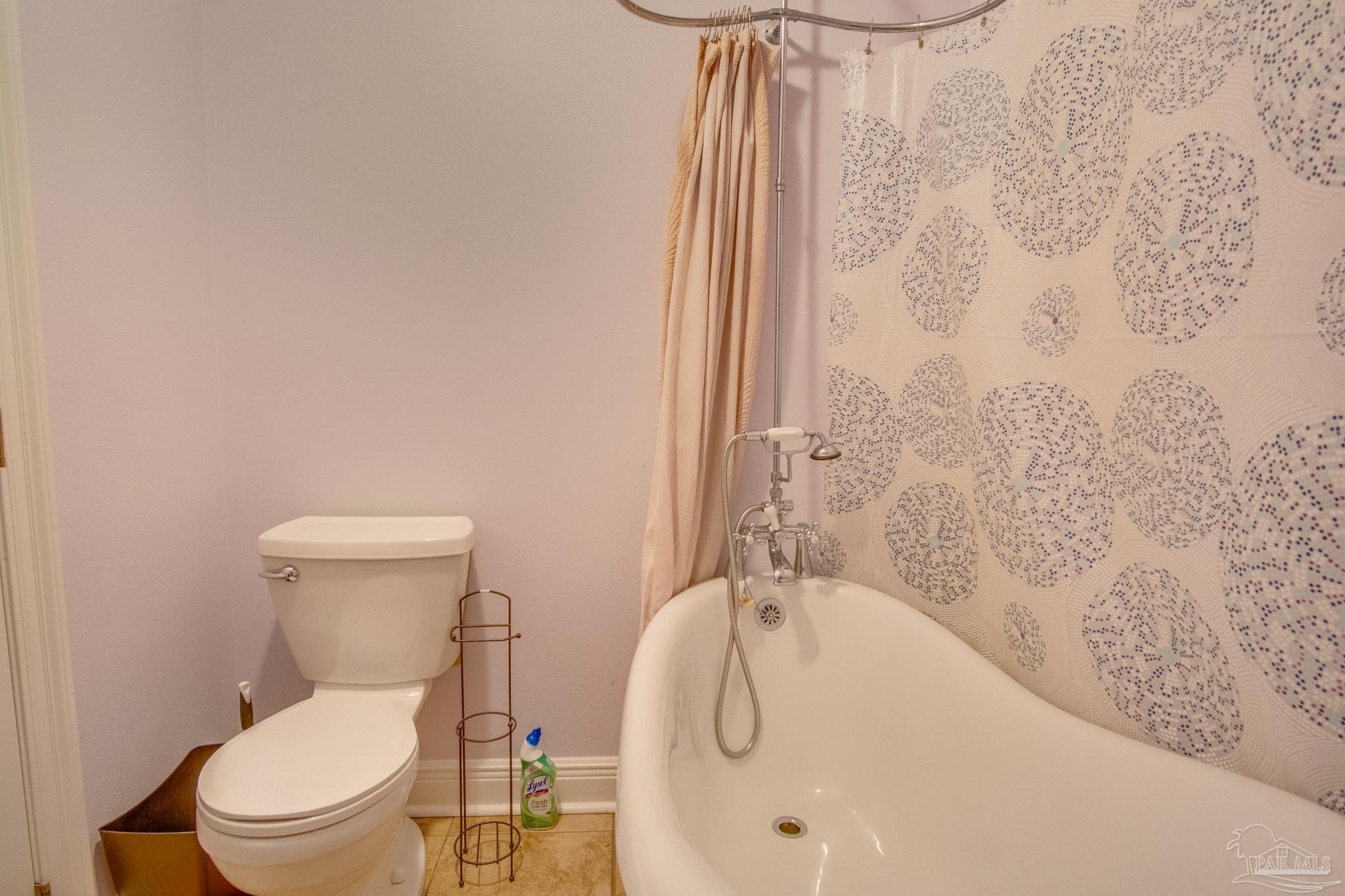 2655 Masters Boulevard Navarre, FL 32566 - Photo 36 of 43 a bathroom with a toilet and a shower