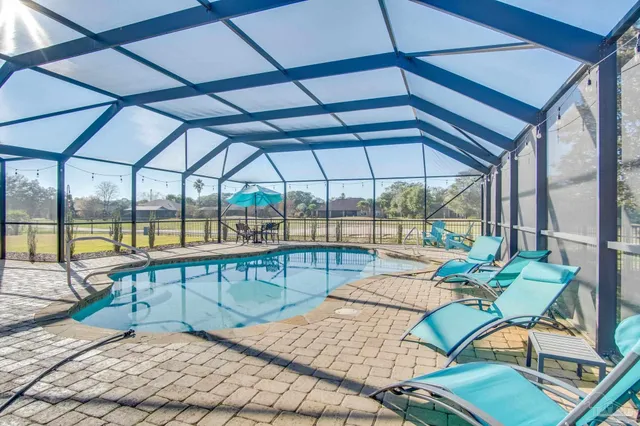 a view of a swimming pool with a patio