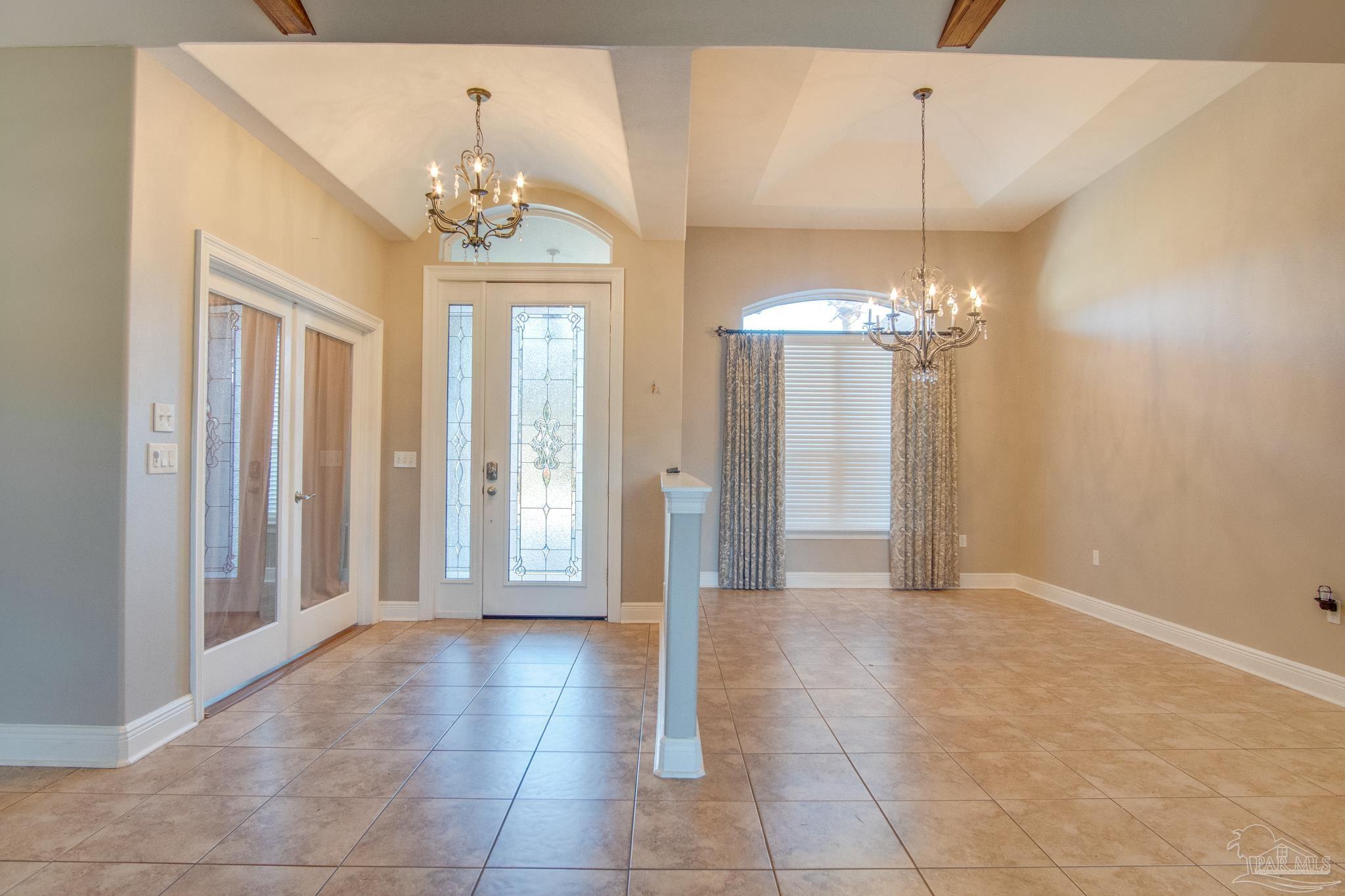 2655 Masters Boulevard Navarre, FL 32566 - Photo 5 of 43 a view of a chandelier in a room