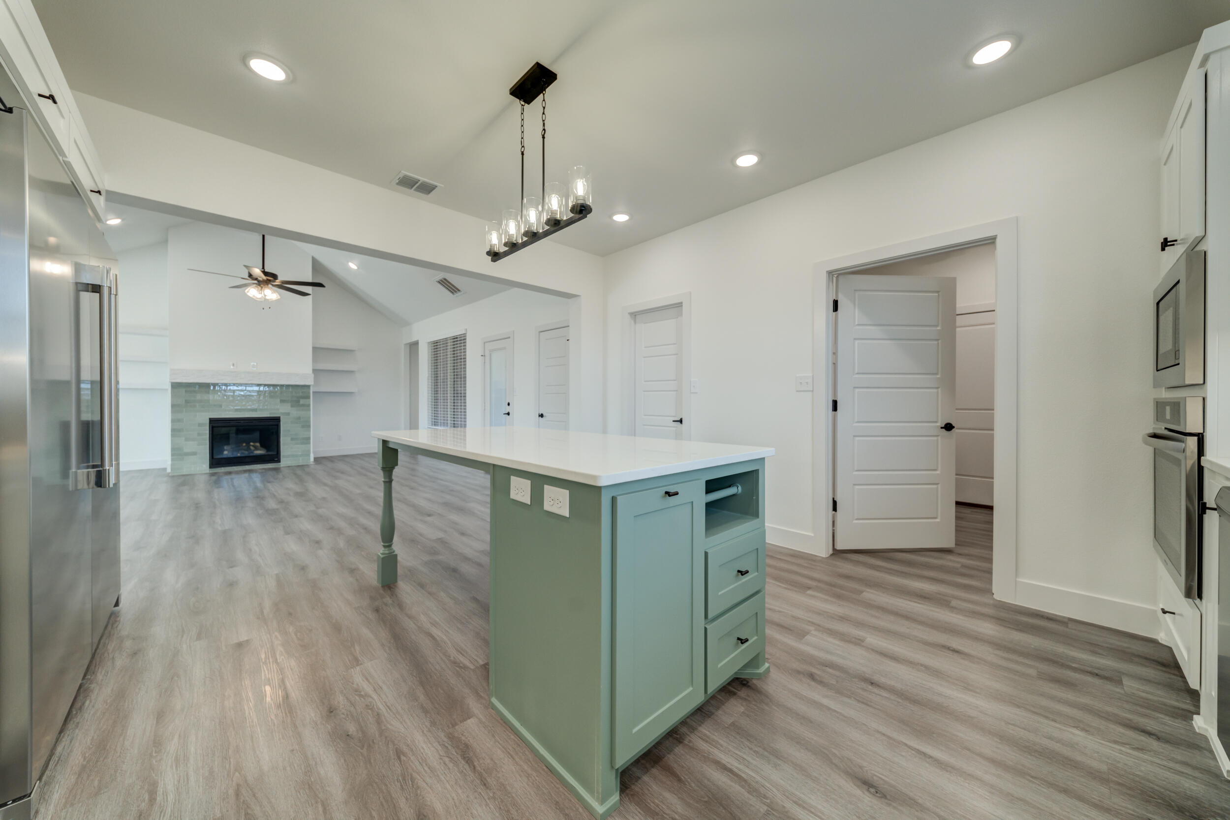 7522 56th Street Lubbock, TX 79407 - Photo 18 of 47 a spacious bathroom with a sink a mirror a vanity and a shower