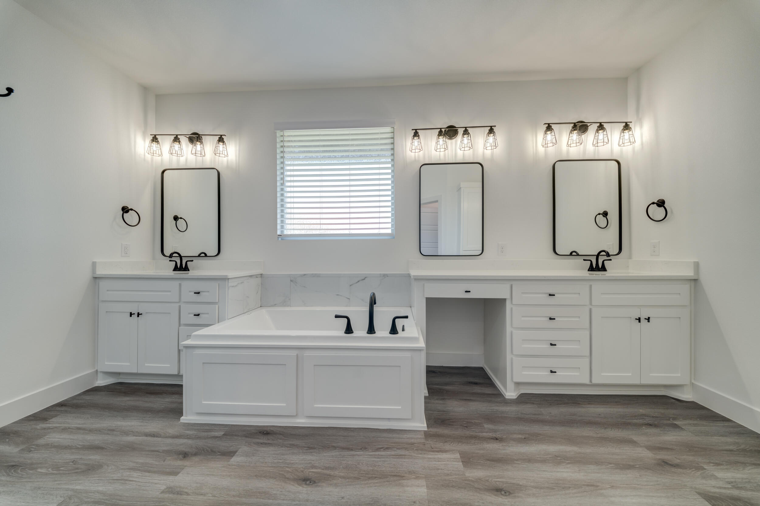 7522 56th Street Lubbock, TX 79407 - Photo 39 of 47 a bathroom with double vanity sink a two mirror and window