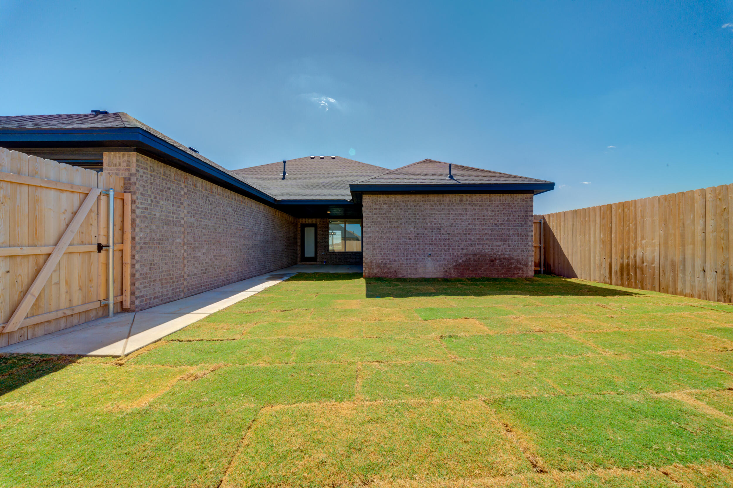 7522 56th Street Lubbock, TX 79407 - Photo 47 of 47 a front view of a house with a yard