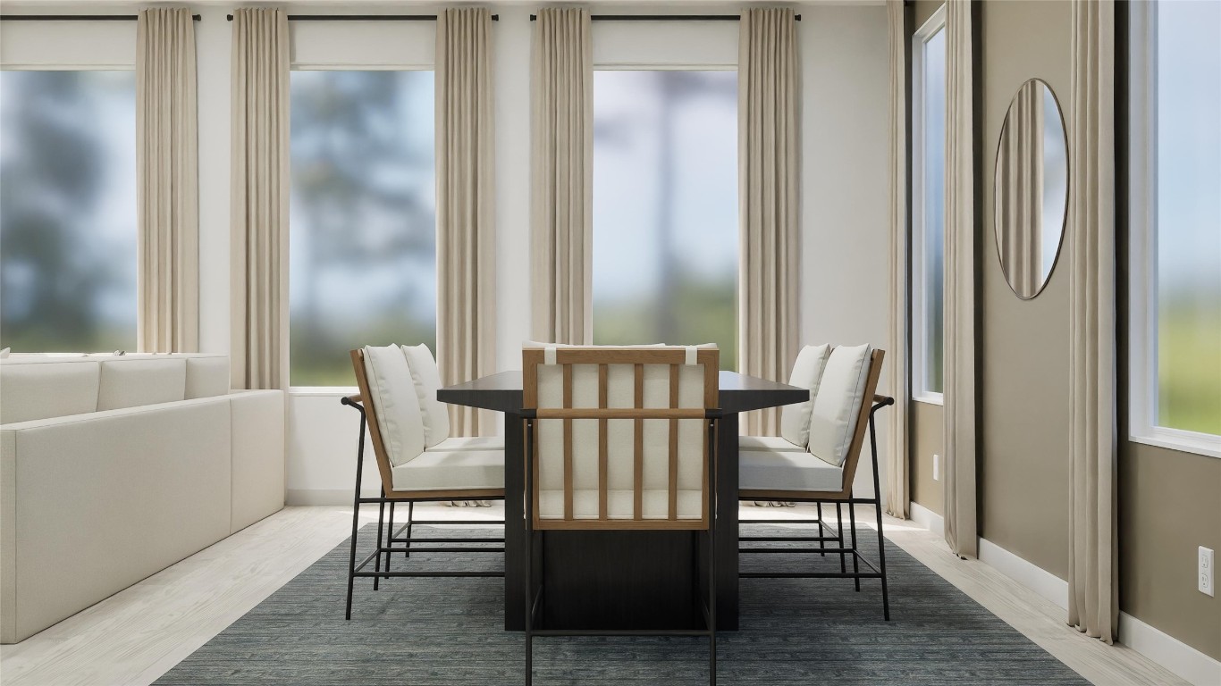 179 Rodney Boat Road Kyle, TX 78640 - Photo 10 of 26 a view of a dining room with furniture and wooden floor