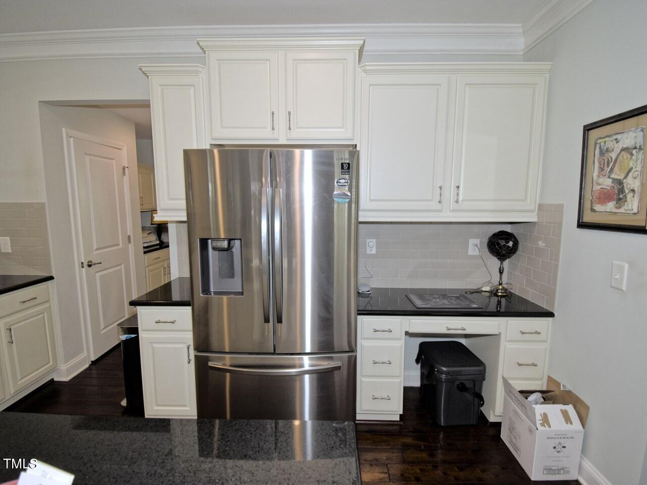 5636 Wade Park Boulevard Raleigh, NC 27607 - Photo 6 of 30 a kitchen with stainless steel appliances granite countertop a refrigerator and a stove top oven