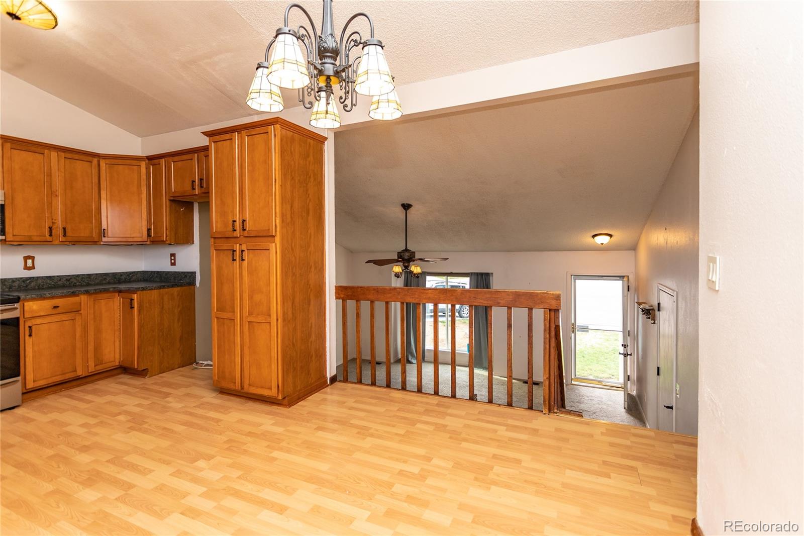 650 Howe Circle Castle Rock, CO 80104 - Photo 15 of 45 a view of a hallway with a chandelier