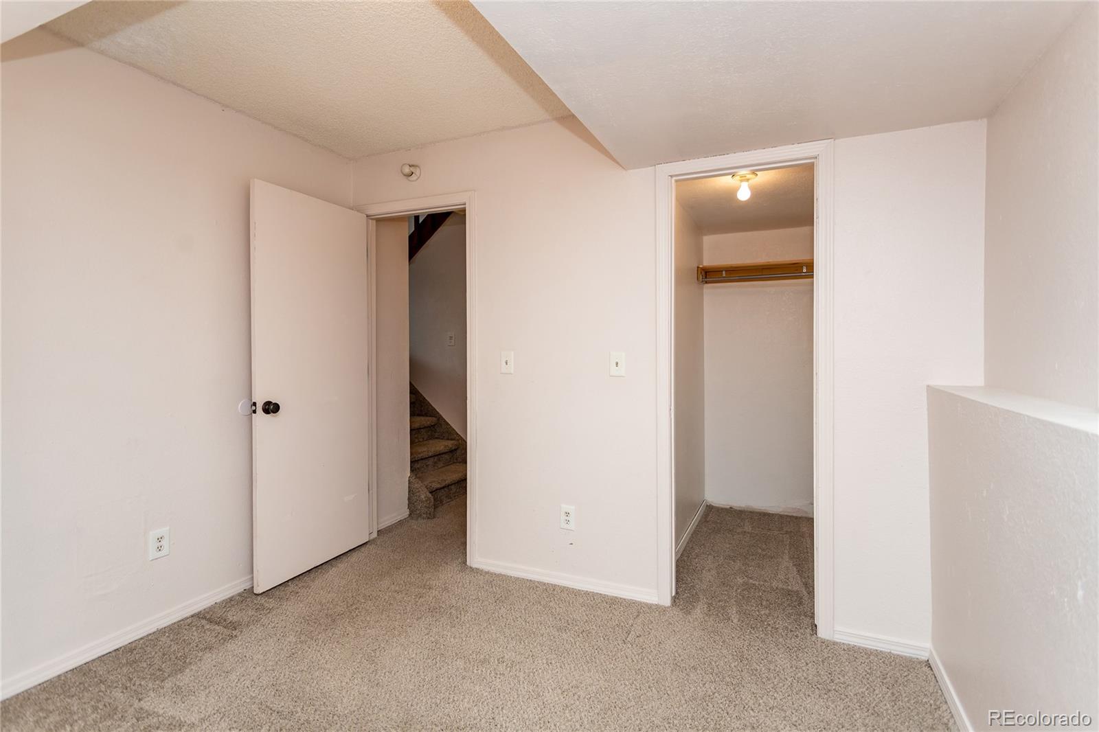 650 Howe Circle Castle Rock, CO 80104 - Photo 22 of 45 a view of an empty room with closet and a hallway