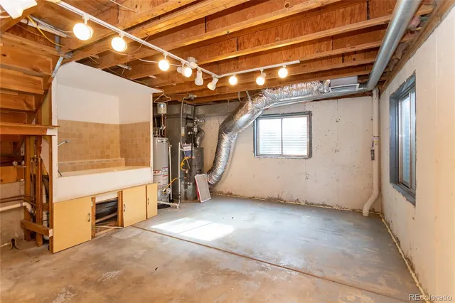 a view of an empty room with a fireplace