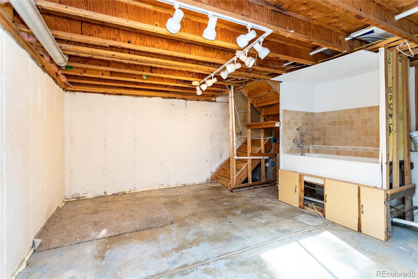 650 Howe Circle Castle Rock, CO 80104 - Photo 30 of 45 a view of a room with wooden floor and windows