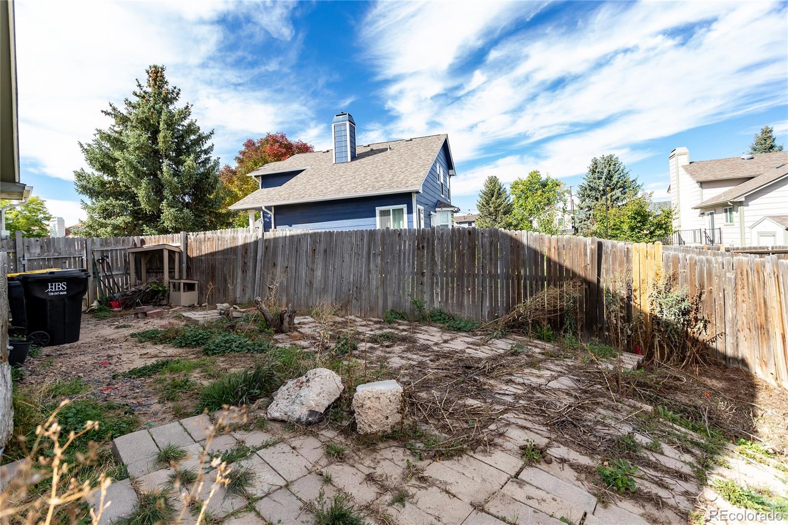 650 Howe Circle Castle Rock, CO 80104 - Photo 36 of 45 a backyard of a house with table and chairs