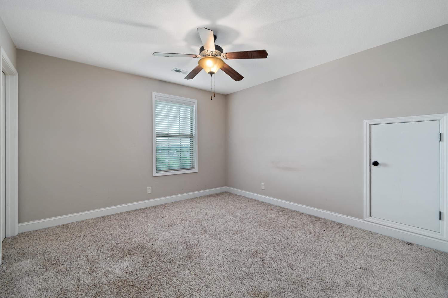 299 7 Mile Ferry Road Cunningham, TN 37052 - Photo 24 of 30 wooden floor in an empty room with a window