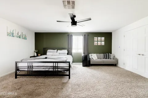 a bedroom with furniture and window
