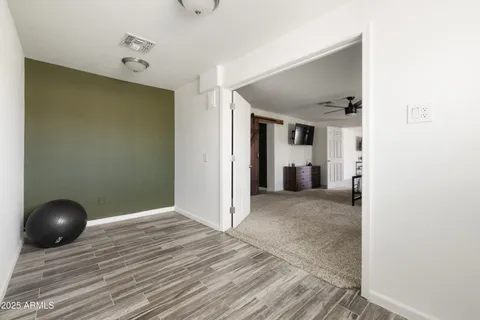 a view of a livingroom and wooden floor