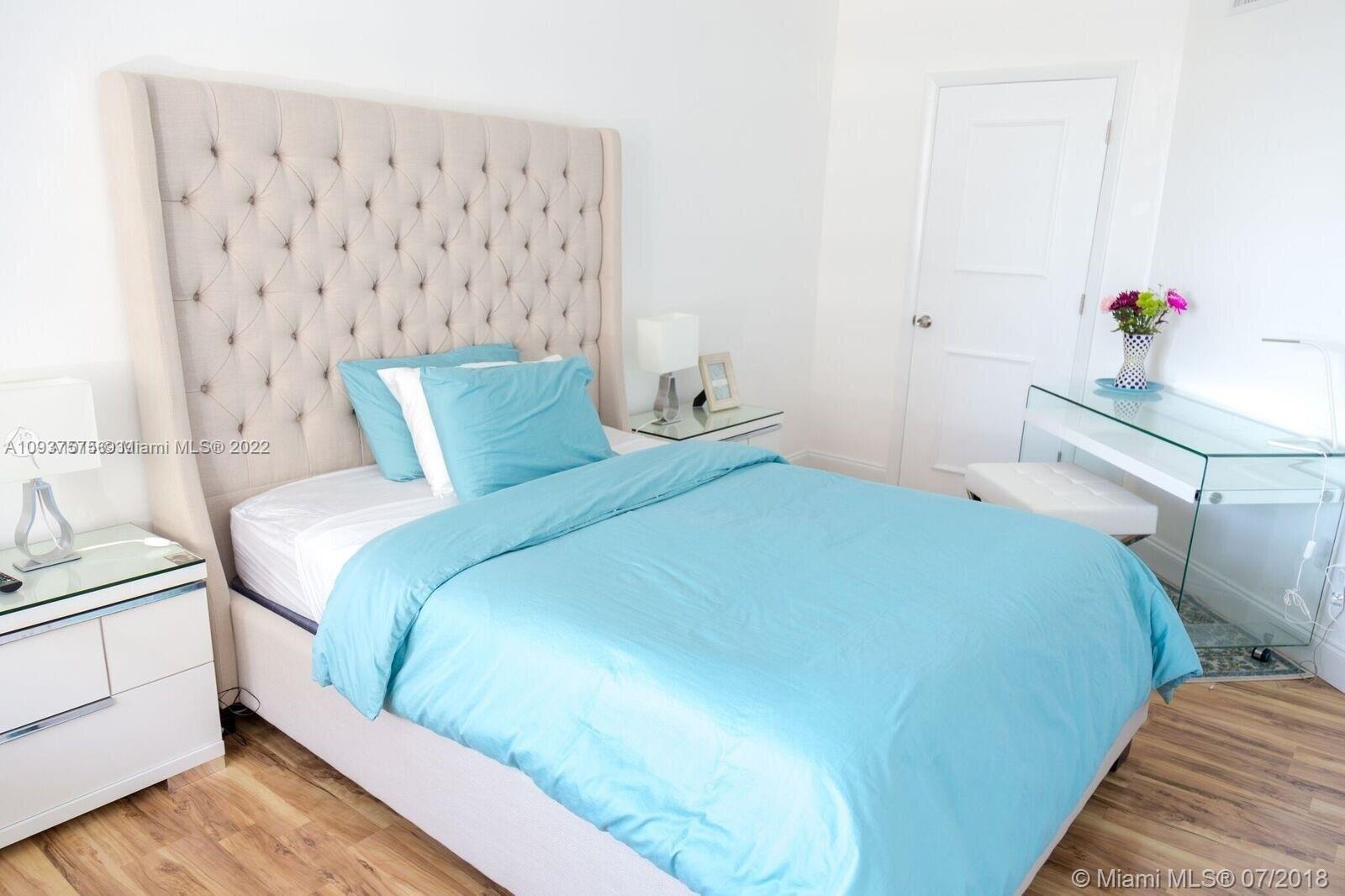 100 Lincoln Road, Unit 309 Miami Beach, FL 33139 - Photo 7 of 17 a bedroom with a bed and a window