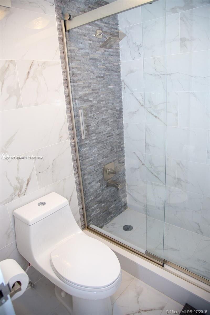 100 Lincoln Road, Unit 309 Miami Beach, FL 33139 - Photo 8 of 17 a bathroom with a toilet and a shower