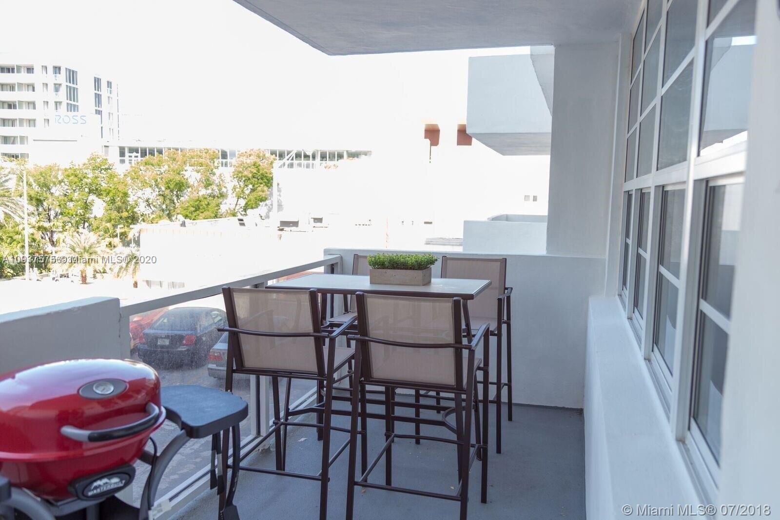 100 Lincoln Road, Unit 309 Miami Beach, FL 33139 - Photo 10 of 17 a view of a dining room with furniture and a window
