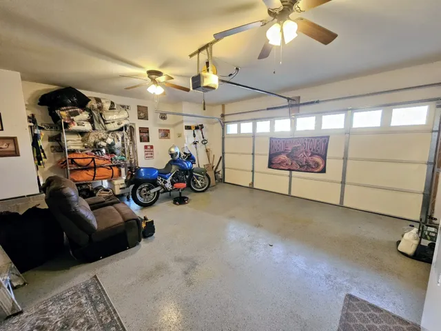 a spacious bathroom with a double vanity sink a mirror and a bathtub