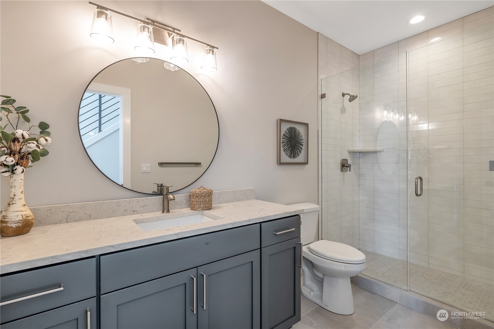 421 Rockefeller Avenue Everett, WA 98201 - Photo 14 of 35 a bathroom with a toilet a sink and mirror