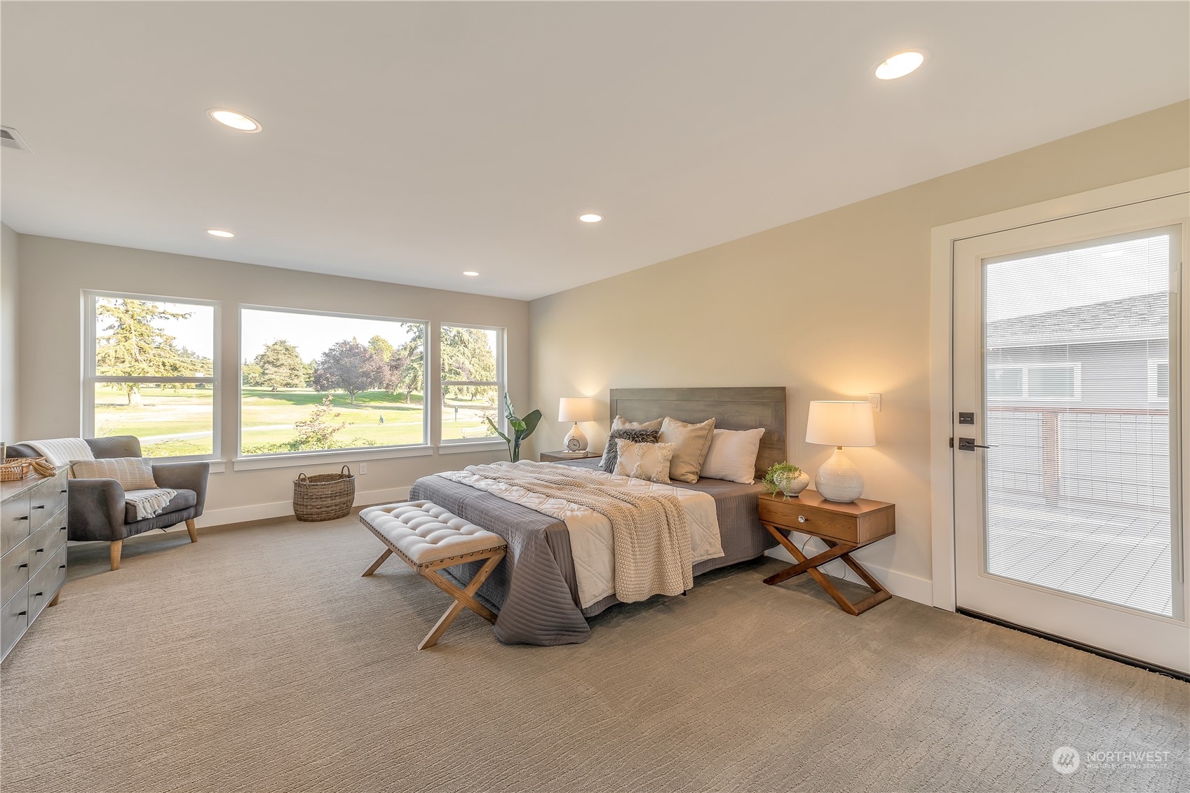 421 Rockefeller Avenue Everett, WA 98201 - Photo 21 of 35 a spacious bedroom with a bed and a large window